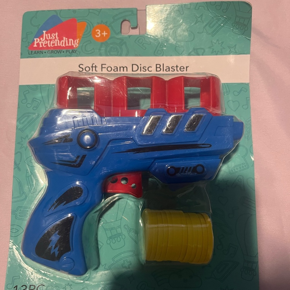 Blue and Red Foam Disc Blaster with Trigger and Circular Opening (first picture)
